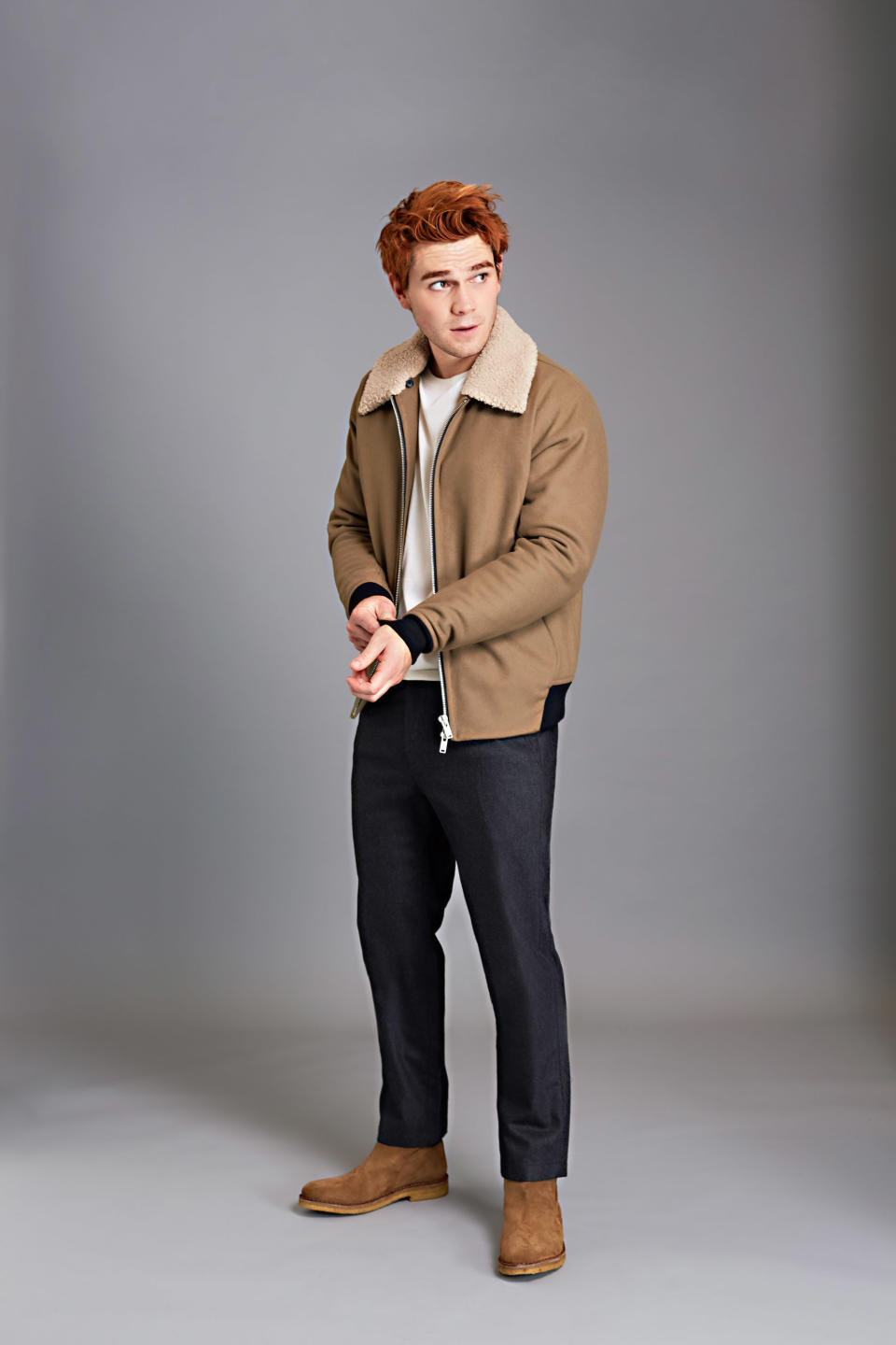 <p>Jacket and trousers by Theory, sweater by Louis Vuitton, boots by AMI Paris.</p>
