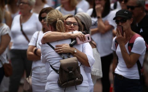 Two women hug at the memorial march for Ms Millane - Credit: Phil Walter/Getty Images