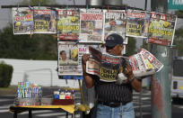 <p>A vendor reads a newspaper on the streets of Mexico City on Sept. 8, 2017 after the country was hit with a powerful earthquake. (Photo: Alfredo Estrella/AFP/Getty Images) </p>