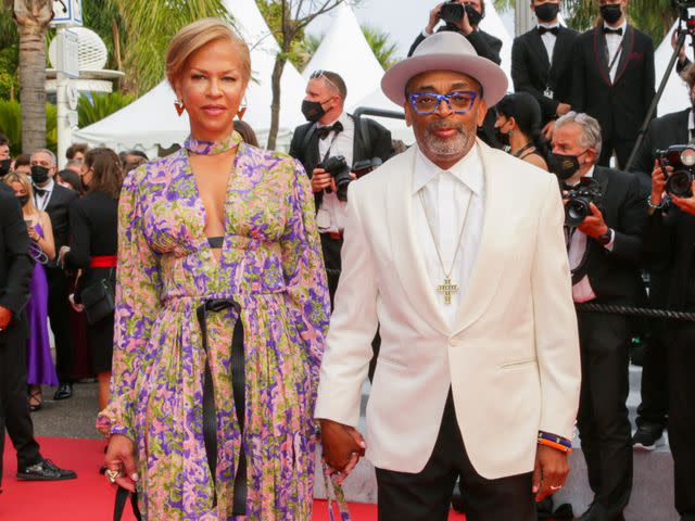 <p>Stephane Cardinale - Corbis/Corbis/Getty</p> Spike Lee and Tonya Lewis Lee attend the "The French Dispatch" screening during the 74th annual Cannes Film Festival on July 12, 2021 in Cannes, France.