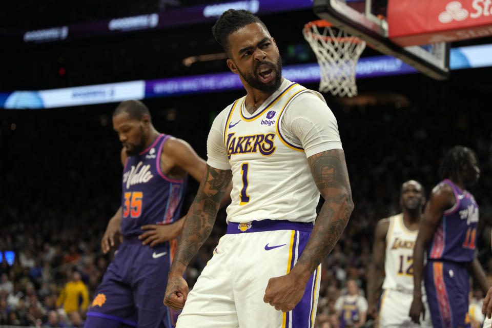 Los Angeles Lakers guard D'Angelo Russell (1) reacts after blocking a shot by Phoenix Suns guard Devin Booker (not shown) during the second half of an NBA basketball game, Sunday, Feb. 25, 2024, in Phoenix. (AP Photo/Rick Scuteri)