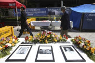 Portraits of the late former South Korean comfort women are displayed near Japanese Embassy in Seoul, South Korea, Wednesday, April 21, 2021. A South Korean court on Wednesday rejected a claim by South Korean sexual slavery victims and their relatives who sought compensation from the Japanese government over their wartime sufferings. (AP Photo/Ahn Young-joon)