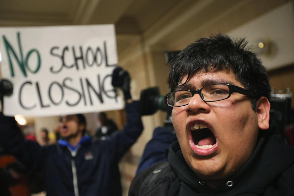 Parents and educators alike protested the closure of dozens of Chicago schools in 2013. (Scott Olson/Getty Image)