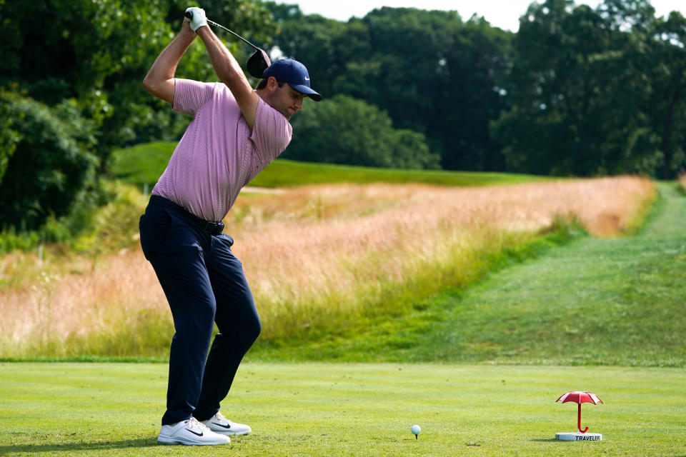 Scottie Scheffler hits on the 14th hole during the first round of the Travelers Championship golf tournament at TPC River Highlands, Thursday, June 23, 2022, in Cromwell, Conn. (AP Photo/Seth Wenig)