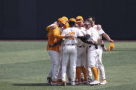 Tennessee players gather on the field after losing to Notre Dame in an NCAA college baseball super regional game Sunday, June 12, 2022, in Knoxville, Tenn. (AP Photo/Randy Sartin)