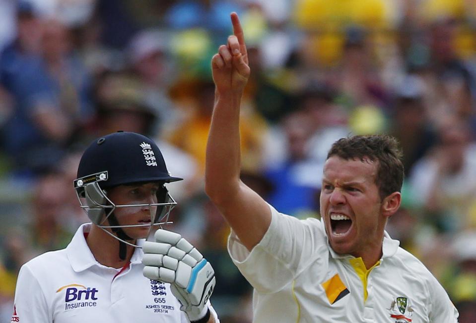 Australia's Peter Siddle (R) celebrates after taking the wicket of England's Michael Carberry (not pictured) during the fourth day of the second Ashes test cricket match at the Adelaide Oval December 8, 2013.