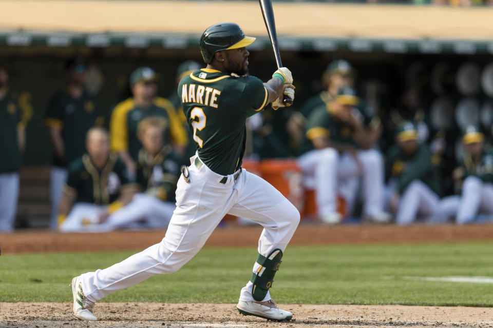 Oakland Athletics' Starling Marte hits an RBI for a walk-off win against the Houston Astros in the ninth inning of a baseball game in Oakland, Calif., Saturday, Sept. 25, 2021. The Athletics won 2-1. (AP Photo/John Hefti)