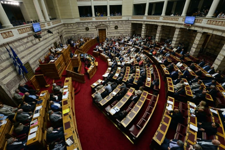 Greek Prime Minister Alexis Tsipras addresses a session at the parliament in Athens, on July 23, 2015