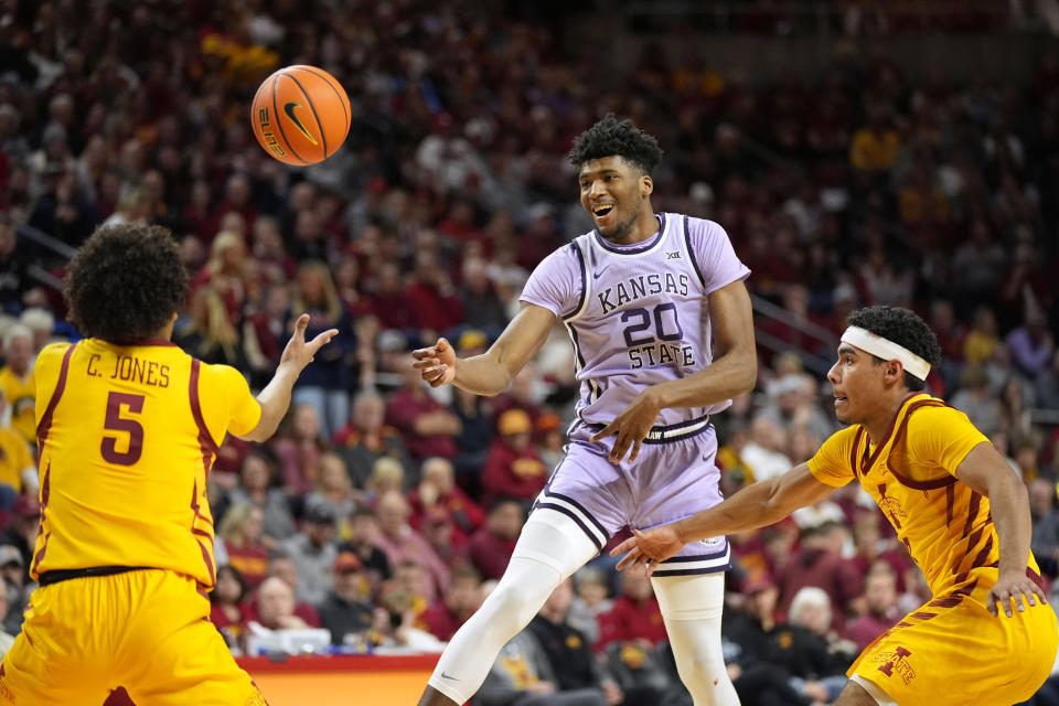 Kansas State forward Jerrell Colbert (20) loses the ball between Iowa State guard Curtis Jones (5) and guard Tamin Lipsey, right, during the first half of an NCAA college basketball game, Wednesday, Jan. 24, 2024, in Ames, Iowa. (AP Photo/Charlie Neibergall)