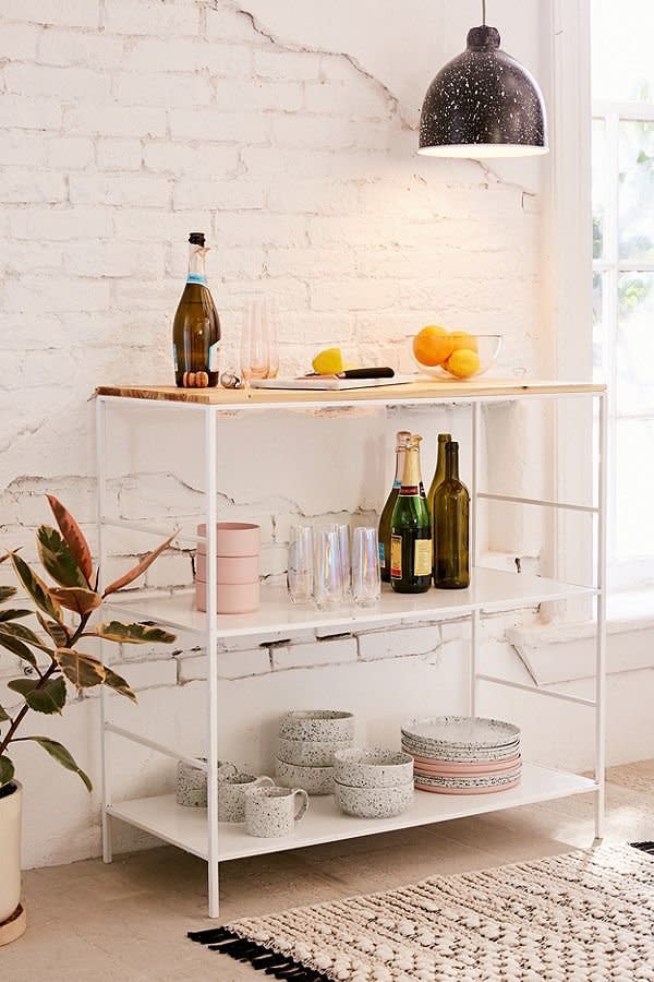 Whether you use this as an island, a standing breakfast bar, or a standing pantry, <a href="https://www.urbanoutfitters.com/shop/ari-counter-table2?category=furniture&amp;color=010" target="_blank">this counter table</a> is the next functional piece your small kitchen needs.