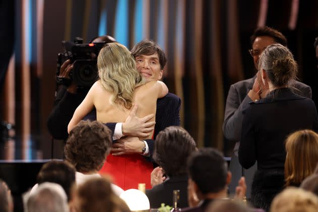 Emily Blunt hugs Cillian Murphy as he wins at the Screen Actors Guild Awards.