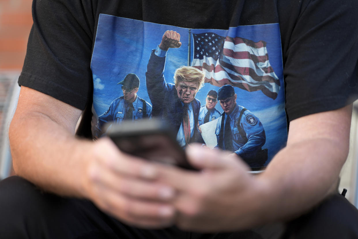 Joseph Wiederien wears a Republican presidential nominee former President Donald Trump t-shirt as he speaks during an interview with The Associated Press, Friday, Sept. 6, 2024, in Des Moines, Iowa. (AP Photo/Charlie Neibergall)