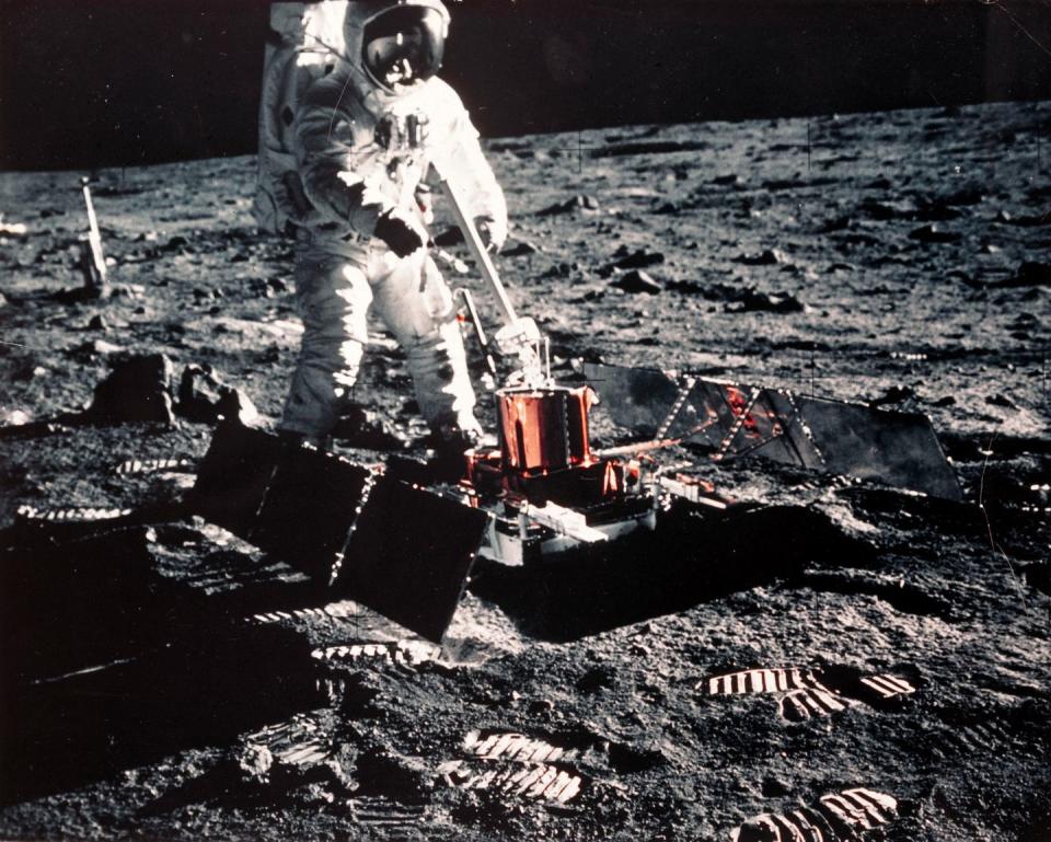 <p>Aldrin does science experiments on the moon. </p>