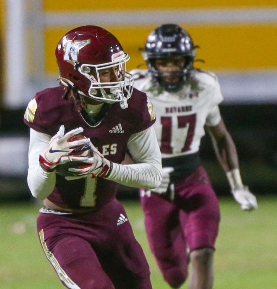 Niceville WR Caden Bridgeman turns towards the end zone for a touchdown after catching the ball on a flea flicker play during the Niceville Navarre football game at Niceville.