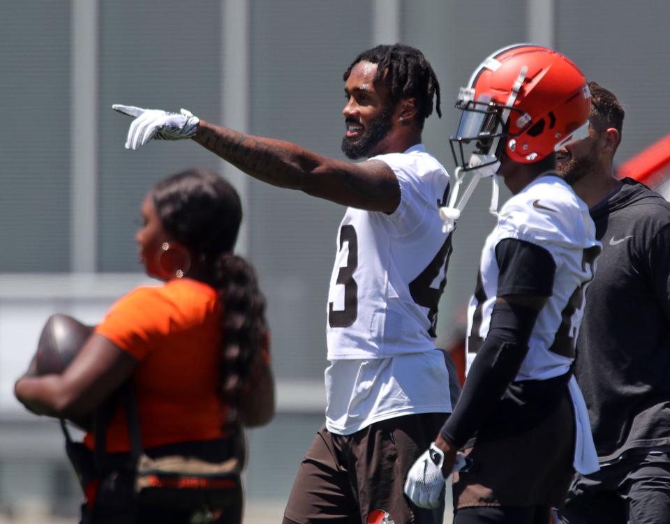 Cleveland Browns safety John Johnson III chats with cornerback Denzel Wards during an NFL football practice at the team's training facility, Wednesday, June 16, 2021, in Berea, Ohio.