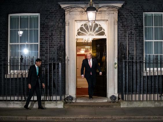 Boris Johnson and Rishi Sunak take part in the national Clap for Our Carers event on Thursday evening (PA)