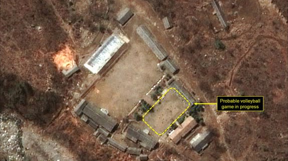 <p>North Korea's military has been spotted seemingly playing a game of volleyball at the main Punggye-ri nuclear test site.</p> <p>Satellite images of the site appear to show two six-player teams facing each other, with a net between them.</p> <p>Joseph Bermudez, an analyst for non-profit <a rel="nofollow noopener" href="http://38north.org/2017/04/punggye041917/" target="_blank" data-ylk="slk:38 North;elm:context_link;itc:0;sec:content-canvas" class="link ">38 North</a>, which first noticed the pictures, said multiple games were going on at the facility — at the administrative area, the support area, the command centre, and at the guard barracks.</p>  <p>A possible volleyball net seen in the command center area</p><div><p>Image: DigitalGlobe/Getty Images</p></div> <p>A probable volleyball game seen at the guard barracks at Punggye-ri</p><div><p>Image: DigitalGlobe/Getty Images</p></div><p>The people appear to be standing in formations consistent with volleyball games, he added.</p> <p>But if you thought the North Koreans were taking a break, it's more likely that the games were staged knowing the outside world is looking.</p>  <p>PUNGGYE-RI NUCLEAR TEST SITE, NORTH KOREA - APRIL 16, 2017. Figure 4. Probable volleyball game seen at the command center support area. (Photo DigitalGlobe/38 North via Getty Images)</p><div><p>Image: DigitalGlobe/Getty Images</p></div><p>Analysts <a rel="nofollow noopener" href="https://www.nytimes.com/2017/04/19/world/asia/north-korea-nuclear-test-volleyball.html" target="_blank" data-ylk="slk:told the New York Times;elm:context_link;itc:0;sec:content-canvas" class="link ">told the <em>New York Times</em></a> that the games were probably intended to send a message, as North Korea knows that the Punggye-ri test site is under intense scrutiny.</p> <p>The games could be North Korea's way of indicating that it's pausing its controversial nuclear missile testing activity — or that it's making it seem like it has.</p> <p>Both <a rel="nofollow noopener" href="http://www.fmprc.gov.cn/mfa_eng/xwfw_665399/s2510_665401/2511_665403/t1454907.shtml" target="_blank" data-ylk="slk:China;elm:context_link;itc:0;sec:content-canvas" class="link ">China</a> and <a rel="nofollow noopener" href="https://www.washingtonpost.com/world/asia_pacific/pence-makes-surprise-stop-to-demilitarized-zone-during-korea-trip/2017/04/16/e1da822e-230e-11e7-a1b3-faff0034e2de_story.html?tid=ptv_rellink&utm_term=.fb6a67e47a51" target="_blank" data-ylk="slk:the U.S.;elm:context_link;itc:0;sec:content-canvas" class="link ">the U.S.</a> have raised condemnation of the hermit country's nuclear tests in recent weeks, as Trump places pressure on the North to halt its missile activity.</p> <p>"While strongly suggestive of the completion of preparations for a sixth nuclear test, the imagery alone does not provide any definitive evidence of the installation of a nuclear device or indication of the specific timing for such an event," Bermudez told <em>Mashable</em>.</p> <p>Volleyball games are a normal occurrence at Punggye-ri, according to Melissa Hanham, an analyst at the Middlebury Institute of International Studies in Monterey, California. The game is a popular sport in North Korea. </p> <p>"It doesn't mean anything other than people are there and [that] they are bored," Hanham said in an email to <em>Mashable. </em></p> <p>Both Hanham and Bermudez agreed that the site could still be ready for a nuclear test. </p> <p>38 North described the site as "primed and ready" <a rel="nofollow noopener" href="http://38north.org/2017/04/punggyeri041217/" target="_blank" data-ylk="slk:on April 12;elm:context_link;itc:0;sec:content-canvas" class="link ">on April 12</a>, and a UN representative of the reclusive dictatorship confirmed that a new nuclear test was <a rel="nofollow noopener" href="http://www.channelnewsasia.com/news/asiapacific/north-korea-says-ready-to-react-to-any-mode-of-war-from-us/3685330.html" target="_blank" data-ylk="slk:under preparation;elm:context_link;itc:0;sec:content-canvas" class="link ">under preparation</a>. </p> <p><a rel="nofollow noopener" href="http://www.channelnewsasia.com/news/asiapacific/tensions-high-north-korea-readies-nuclear-test-report/3674450.html" target="_blank" data-ylk="slk:Analysts speculated;elm:context_link;itc:0;sec:content-canvas" class="link ">Analysts speculated</a> that the reclusive dictatorship could trigger a nuclear test to mark the 105th birth anniversary of the country's founding leader, Kim Il-Sung, which occurred last Saturday. Kim Il-Sung's grandson, Kim Jong-un, is North Korea's current leader.</p> <p>"The ultimate choice as to whether to test, or not to test, rests solely in the hands of Kim Jong-un," Bermudez said.</p> <div> <h2>WATCH: Scientists discovered a rare giant black worm monster in the Philippines</h2>  </div>