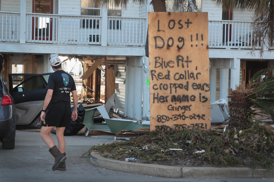 &nbsp;A resident looks for a dog lost during Hurricane Michael in Mexico Beach.