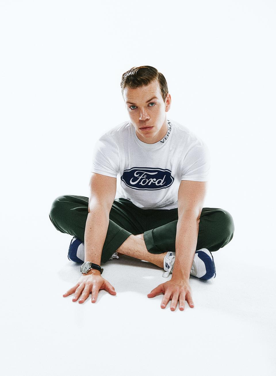 <cite class="credit">T-shirt, $525, by Versace / Pants, $490, by Éditions M.R. / His own sneakers by Nike / Watch, $2,990, by Montblanc</cite>