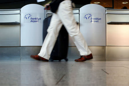 A flight passenger walks through Frankfurt airport, Germany March 7, 2014. REUTERS/Ralph Orlowski/File Photo