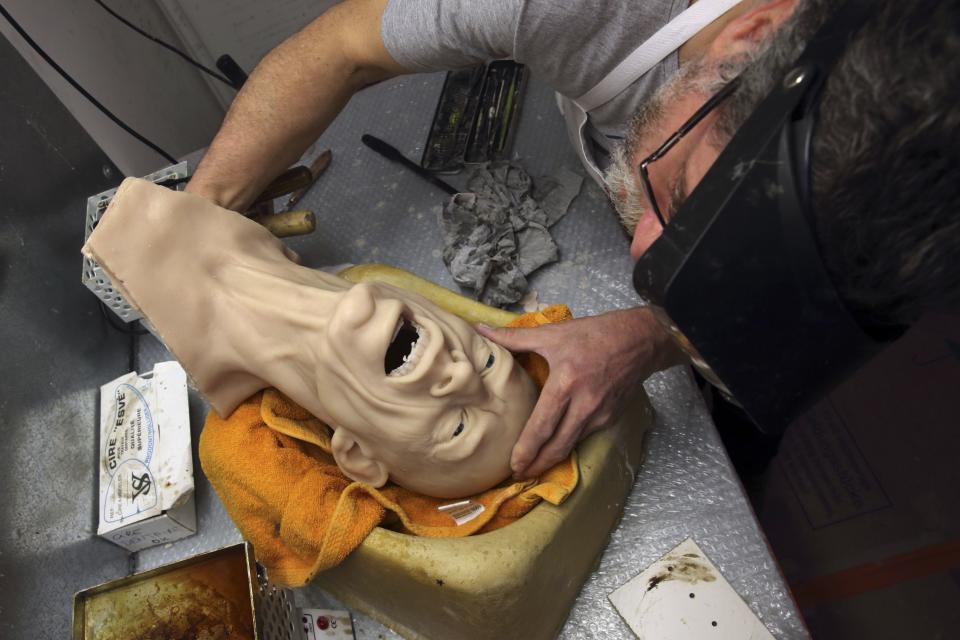 Paris' Grevin Wax Museum sculptor Eric Saint Chaffray works on the head of Rolling Stones lead singer Mick Jagger at their workshop in Paris