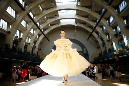 A model presents a creation during the Molly Goddard catwalk show during London Fashion Week in London