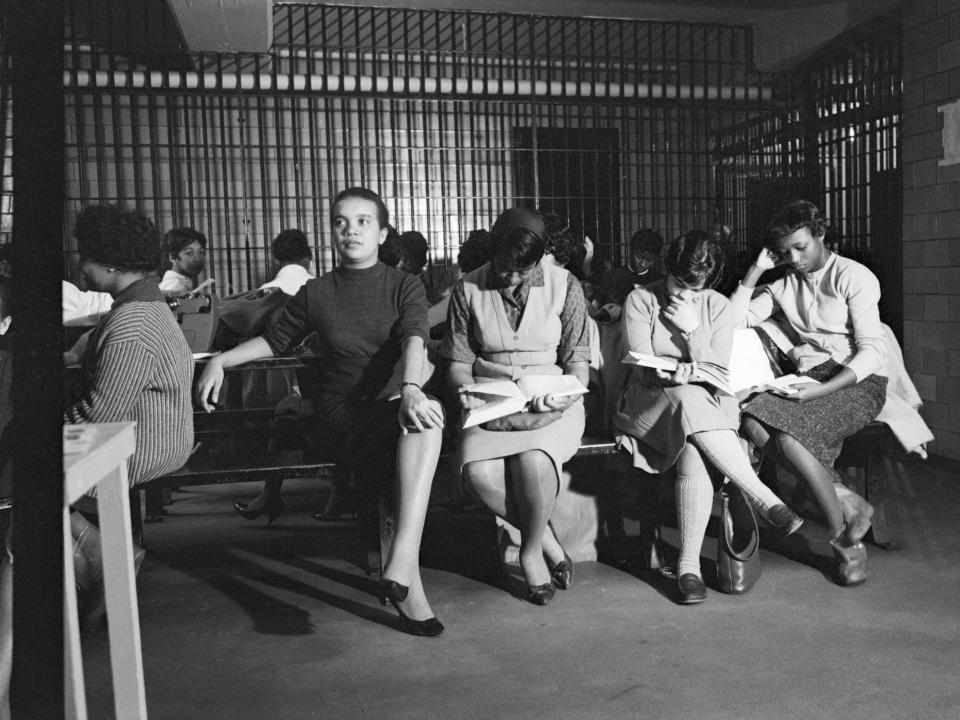 March 15, 1960: College girls arrested in a city-wide wave of restaurant sit-down demonstrations occupy a female detention room at a jail in Atlanta. Many of them are studying college textbooks. A series of segregation protests came almost simultaneously at around ten public eating places.