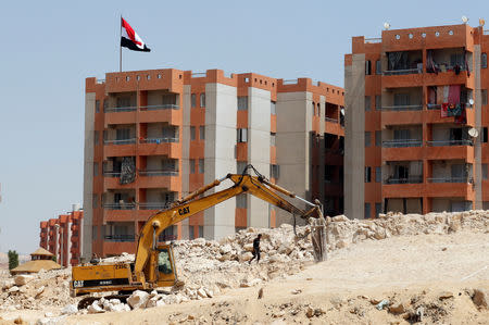 A bulldozer works on the housing project "Long Live Egypt", at Al-Asmarat, a housing complex in Al Mokattam area, at Cairo's desert outskirts, Egypt September 12, 2018. REUTERS/Amr Abdallah Dalsh