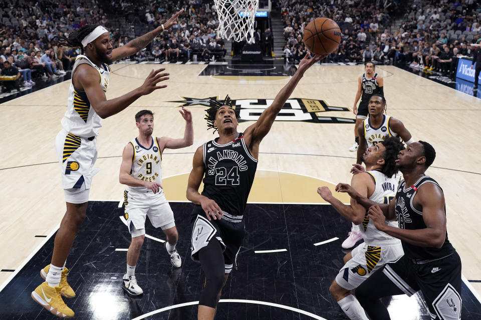 San Antonio Spurs center Khem Birch (24) drives to the basket against the Indiana Pacers during the second half of an NBA basketball game in San Antonio, Thursday, March 2, 2023. (AP Photo/Eric Gay)