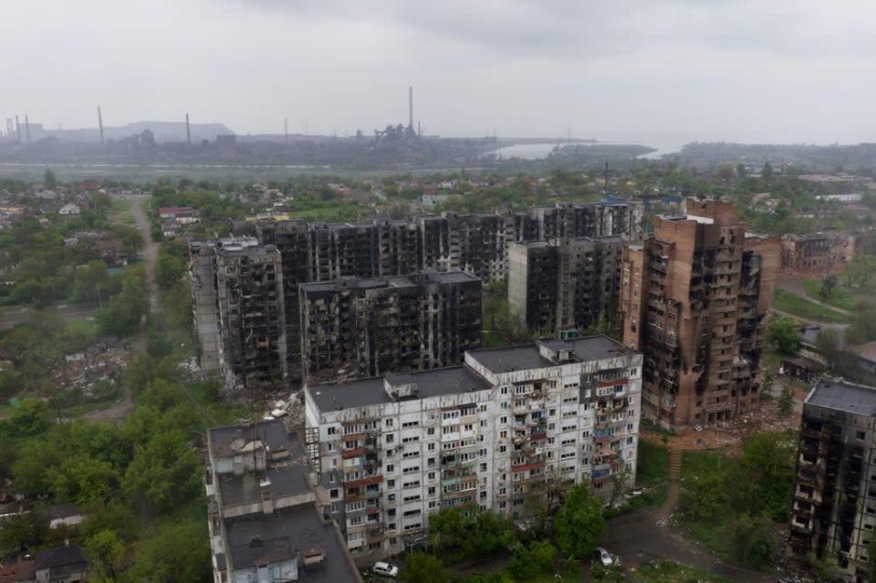Aerial view of damaged residential buildings and the Azovstal steel plant in the background (AFP via Getty Images)