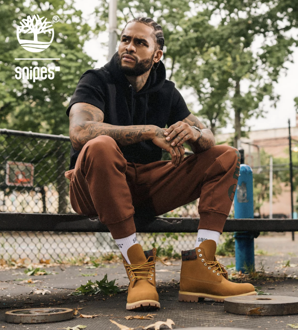 Dave East Wearing Black Hoodie and Timberland Boots