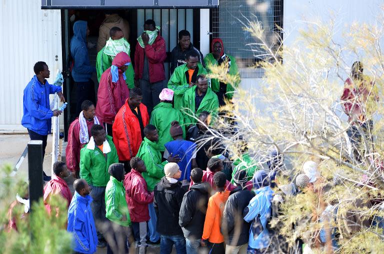 Migrants are pictured at the "Temporary Permanence Centre", a refugee camp, on February 17, 2015 in Lampedusa