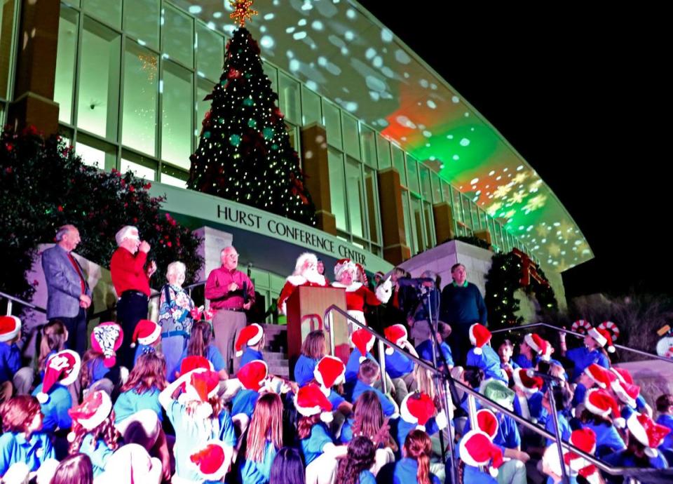 With Santa and Mrs. Clause counting down, student choir members from W. A. Porter Elementary watch as Hurst’s Christmas Tree is lit at the Conference Center on Nov. 29, 2016.