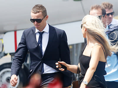 Peter Siddle arrives off the plane in Coffs Harbour en route to Phillip Hughes' funeral.