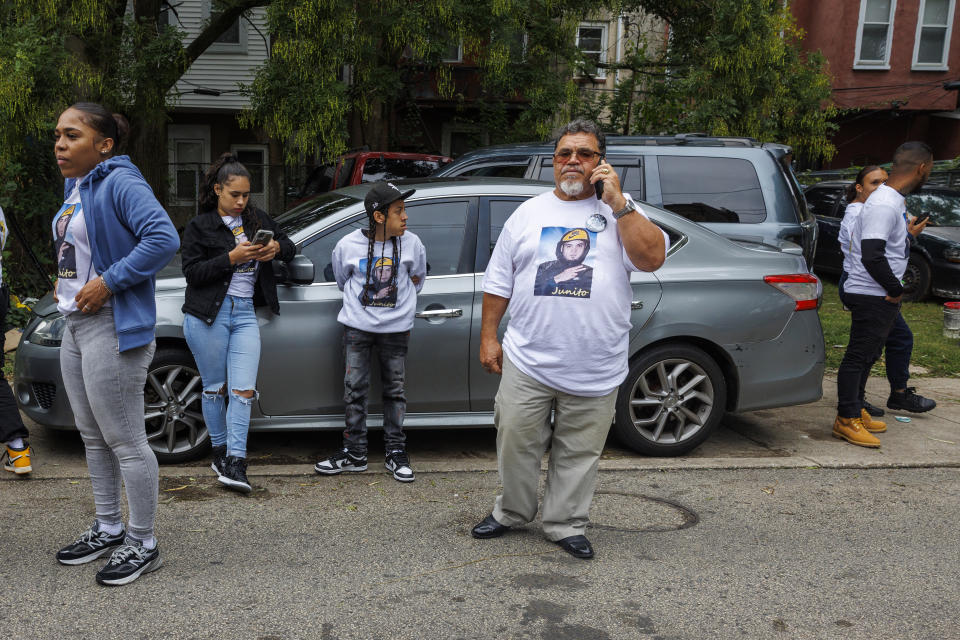 Family of Eddie Irizarry gather outside the Philadelphia home after learning charges were dropped against Philadelphia Police officer Mark Dial, Tuesday, Sept. 26, 2023. A judge has dismissed all charges, including a murder count, against Dial, a Philadelphia police officer who shot and killed Irizarry, a driver. The judge ruled Tuesday after watching video of the fatal shooting of 27-year-old Irizarry by Officer Dial. (Alejandro A. Alvarez/The Philadelphia Inquirer via AP)