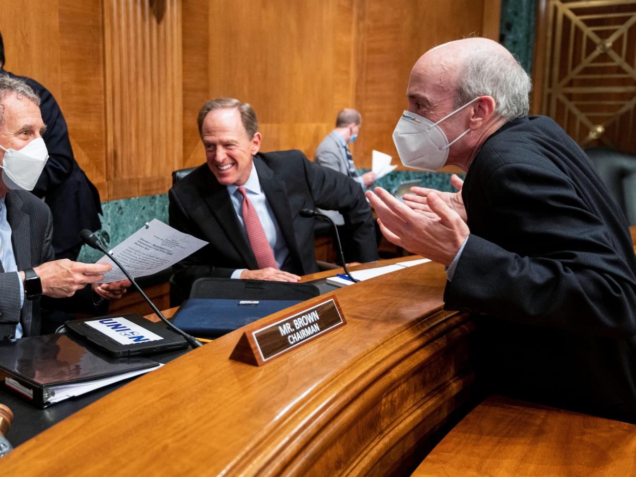 From left, Chairman Sen. Sherrod Brown, D-Ohio, ranking member Sen. Pat Toomey, R-Pa., and Securities and Exchange Commission, Chairman Gary Gensler talk after Senate Banking, Housing, and Urban Affairs Committee hearing on "Oversight of the U.S. Securities and Exchange Commission" on Tuesday, Sept. 14, 2021, in Washington