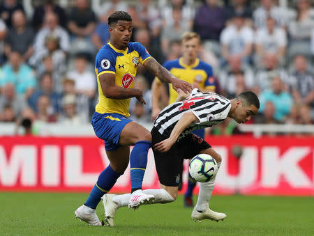 Soccer Football - Premier League - Newcastle United v Southampton - St James' Park, Newcastle, Britain - April 20, 2019 Southampton's Mario Lemina in action with Newcastle United's Miguel Almiron REUTERS/Scott Heppell