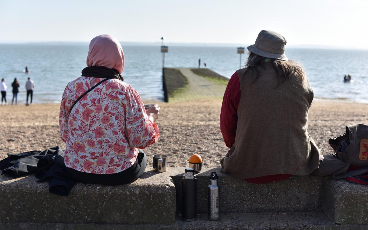  Two friends sit on the sea wall  - John Keeble 