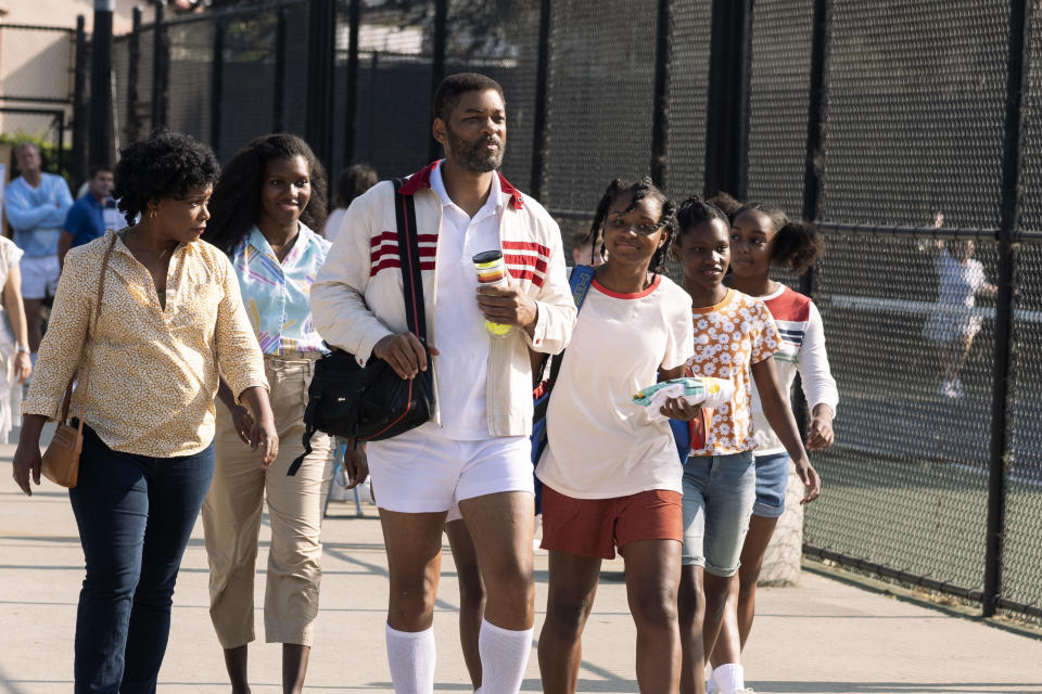 This image released by Warner Bros. Pictures shows, from left, Aunjanue Ellis as Oracene “Brandi” Williams, Mikayla Bartholomew as Tunde Price, Will Smith as Richard Williams, Saniyya Sidney as Venus Williams, Demi Singleton as Serena Williams and Danielle Lawson as Isha Price in "King Richard." (Warner Bros. Pictures via AP)