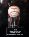 The baseball Mark McGwire hit for home run number 70 is shown at New York's Madison Square Garden Tuesday, Jan. 12, 1999, after it was sold at auction to an undisclosed phone bidder for $2.7 million, plus commission. The previous record for a baseball sold at auction was $126,000, the ball Babe Ruth hit for the first home run in Yankee Stadium. (AP Photo/Ron Frehm)