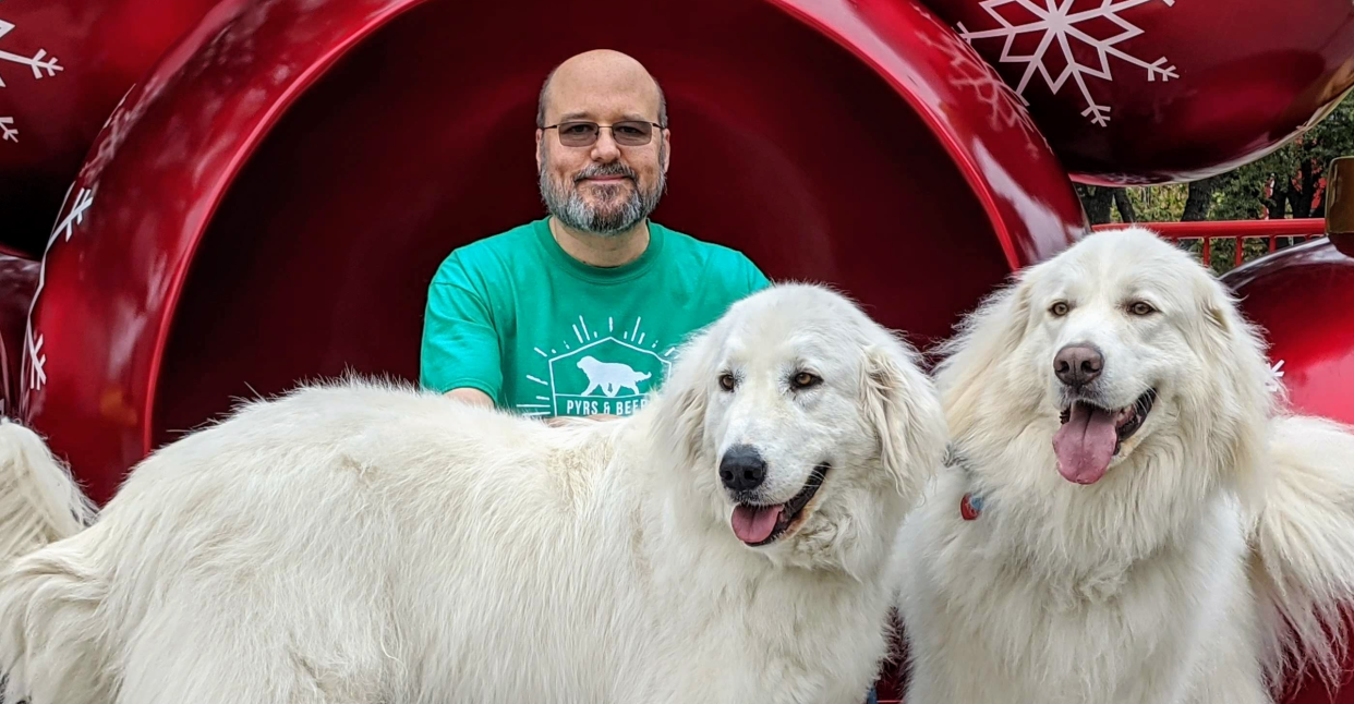 Brook Heimbaugh with his Great Pyrenees, Kodiak and Betty White, in 2022.