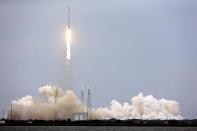 A rocket carrying the SpaceX Dragon ship lifts off from launch complex 40 at the Cape Canaveral Air Force Station in Cape Canaveral, Fla. on Friday, April 18, 2014. The mission will deliver research equipment, food and other supplies to the International Space Station. (AP Photo/John Raoux)