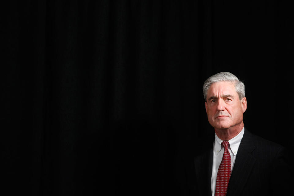 <p>FBI Director Robert Mueller listens as President Barack Obama speaks to staff members of the Joint Terrorism Task Force Headquarters in New York, Tuesday, Oct. 20, 2009. (Photo: Gerald Herbert/AP) </p>