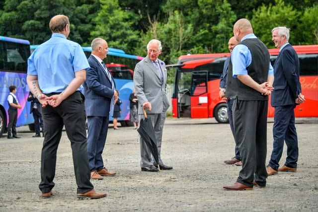 The Prince of Wales meets members of staff during a visit to family run travel and holiday business, Edwards Coaches in Abercynon, near Mountain Ash, South Wales (Ben Birchall/PA)