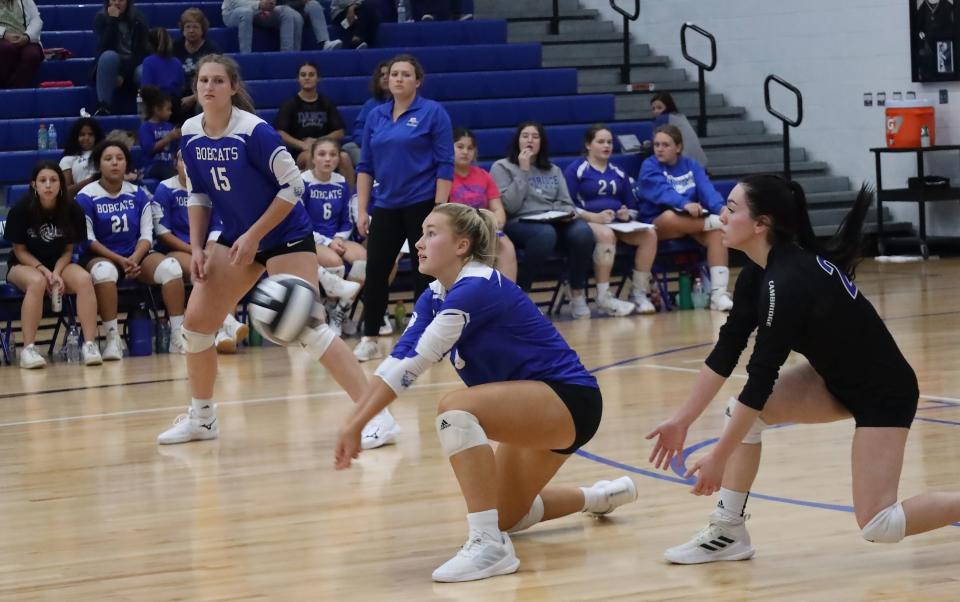 Cambridge's Kylie Taylor (10) bumps the ball to the air during Tuesday's volleyball game with Oak Glen at Cambridge High School Tuesday evening.