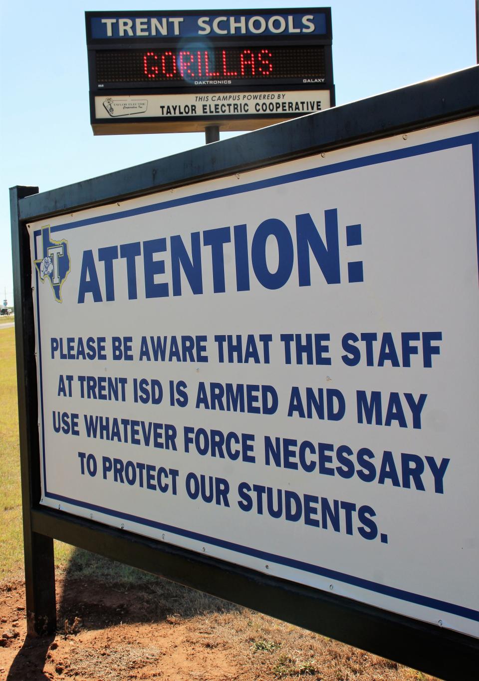Signage at the entrance to the Trent ISD campus warns visitors that school personnel are ready to protect students. The campus faces Interstate 20.