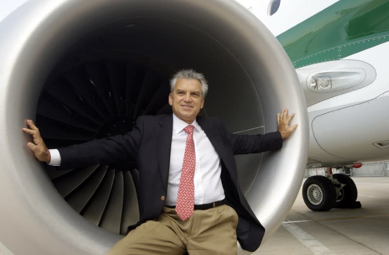 Paulo Cesar de Souza e Silva poses for the photographers after a news conference in Fiumicino, October 6, 2011. REUTERS/Remo Casilli