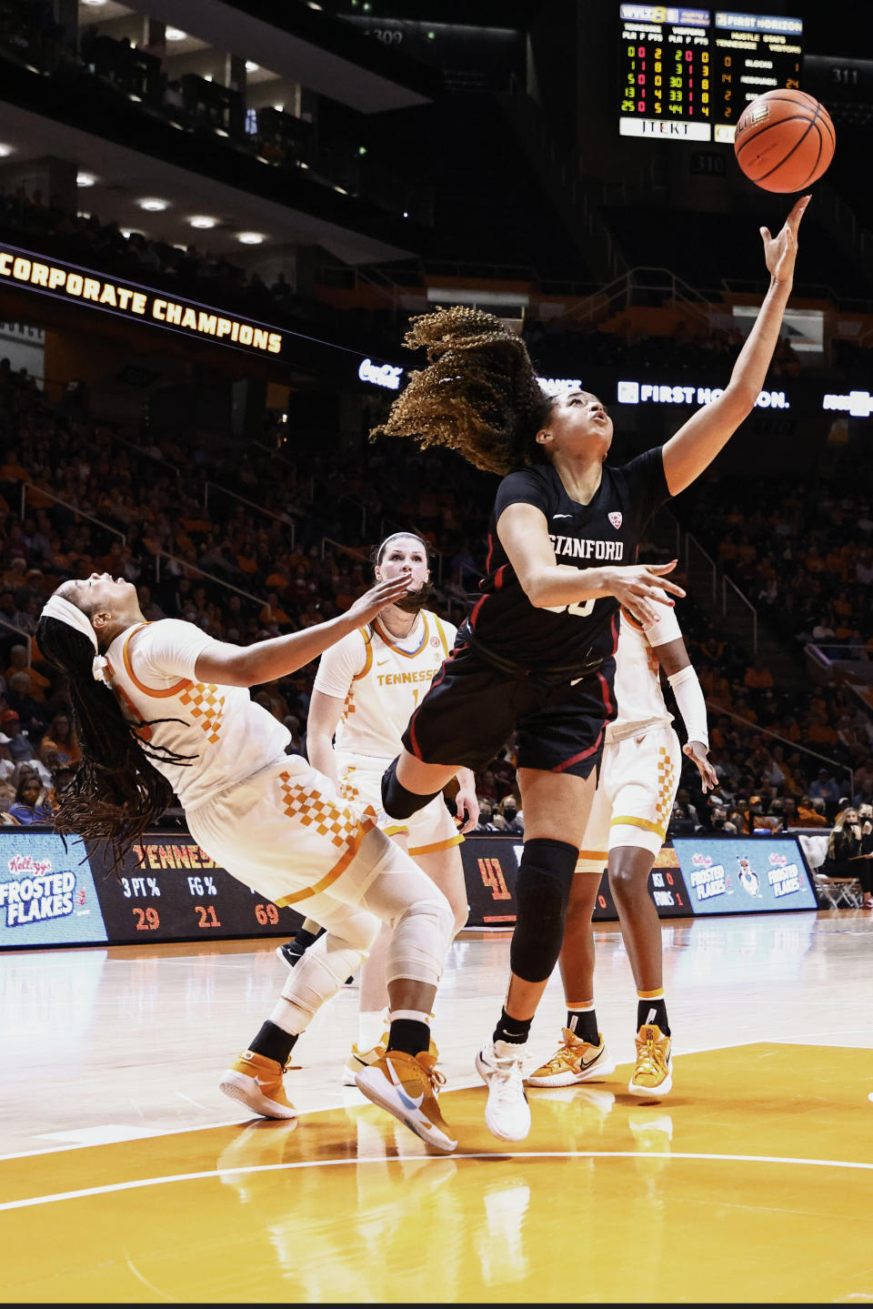 Stanford guard Haley Jones (30) shoots past Tennessee forward Keyen Green (13) during the first half of an NCAA college basketball game Saturday, Dec. 18, 2021, in Knoxville, Tenn. (AP Photo/Wade Payne)