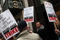 Members of the Writers Guild of America (WGA) East picket outside Peacock Newfront streaming service offices in New York City