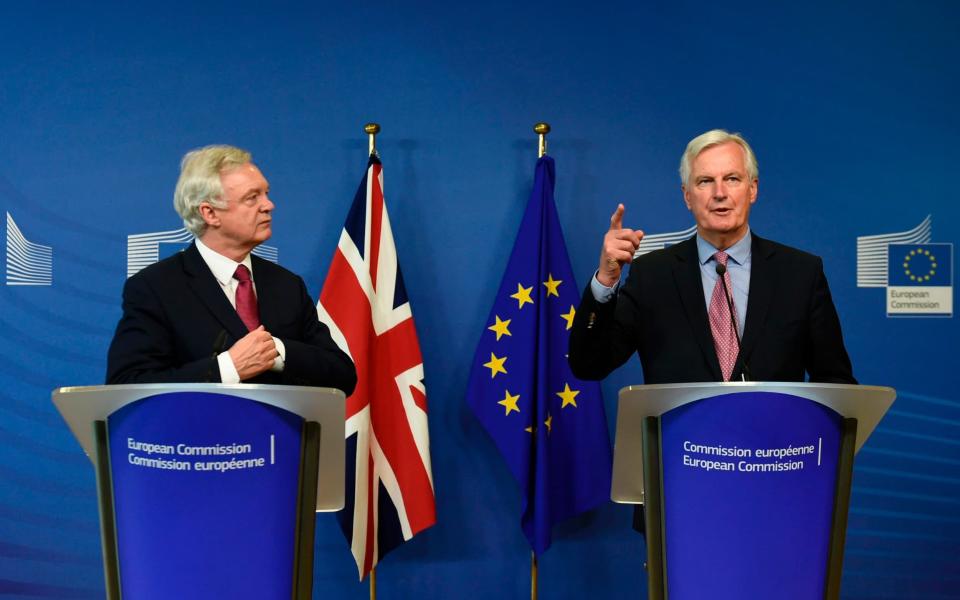 David Davis began negotiations with Michel Barnier today, but economists fear the Government could fall over before they make substantive progress - AFP